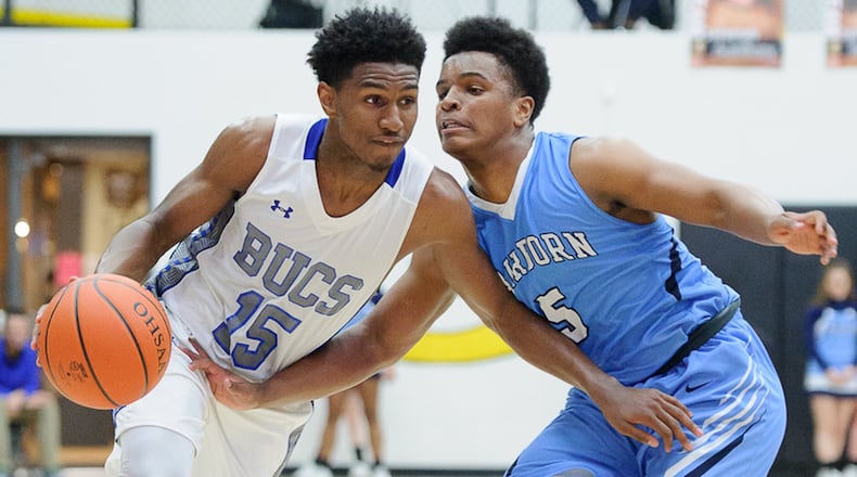 Xenia sophomore guard Samari Curtis dribbles with pressure from Fairbornâs Kermit Redmon during a Division I sectional semifinal on Tuesday at Centerville. Curtis led Xenia with 25 points. Contributed Photo by Bryant Billing