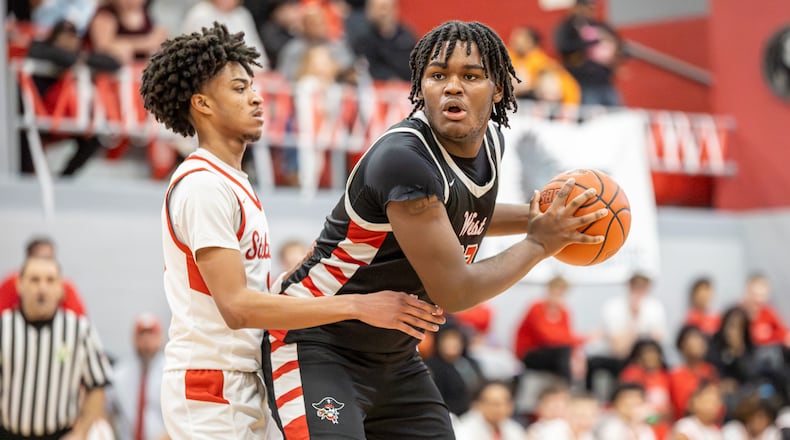 West Carrollton High School senior Joseph Ingram is guarded by Stebbins senior Cayden Bishop during their game on Friday, Feb. 13 at Ron Coleman Gymnasium in Riverside. The Pirates won 46-41. MICHAEL COOPER / STAFF