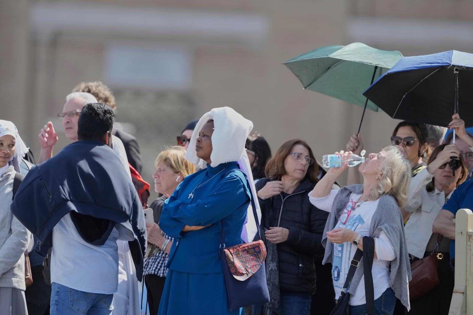 People line up to see the body of Pope Francis is in St. Peter's Basilica at the Vatican, Wednesday, April 23, 2025, where he will lie in state for three days. (AP Photo/Markus Schreiber)