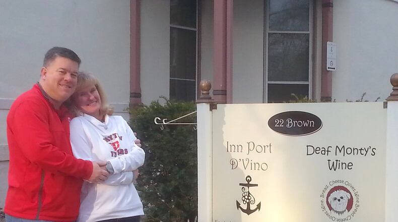 Jeff and Leslie Gonya outside their B&B business in the Oregon Historic District in Dayton. CONTRIBUTED