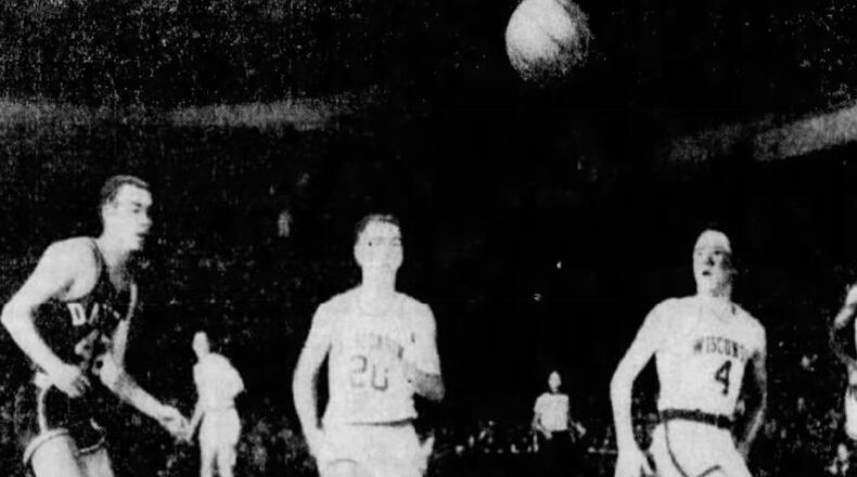 Dayton's Tom Hatton, left, plays against Wisconsin in 1961 at Madison Square Garden. UPI photo