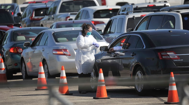Crowds line up Monday morning for antibody testing at UD Arena. The COVID-19 lgG test helps people determine if they had COVID-19 infection. MARSHALL GORBY/STAFF