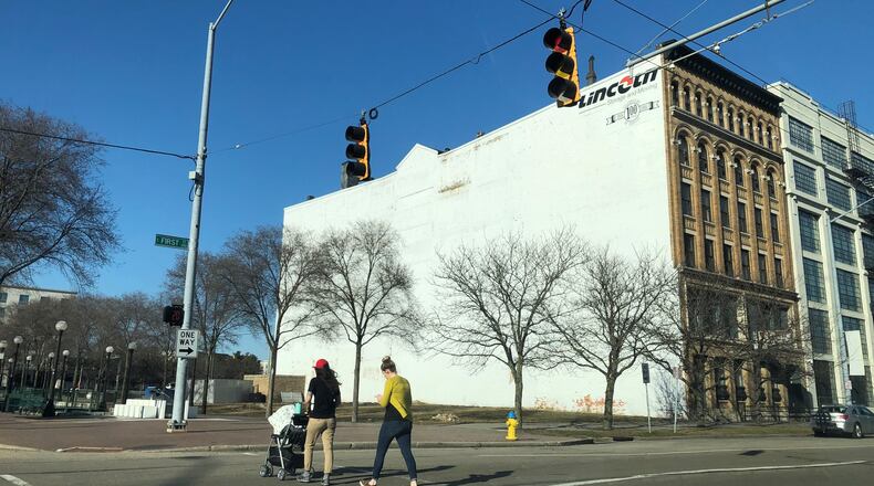 Developer Crawford Hoying says it plans to construct a new apartment building called the Sutton on vacant land next to the Lincoln Storage building, near the Day Air Ballpark, where the Dayton Dragons play. CORNELIUS FROLIK / STAFF
