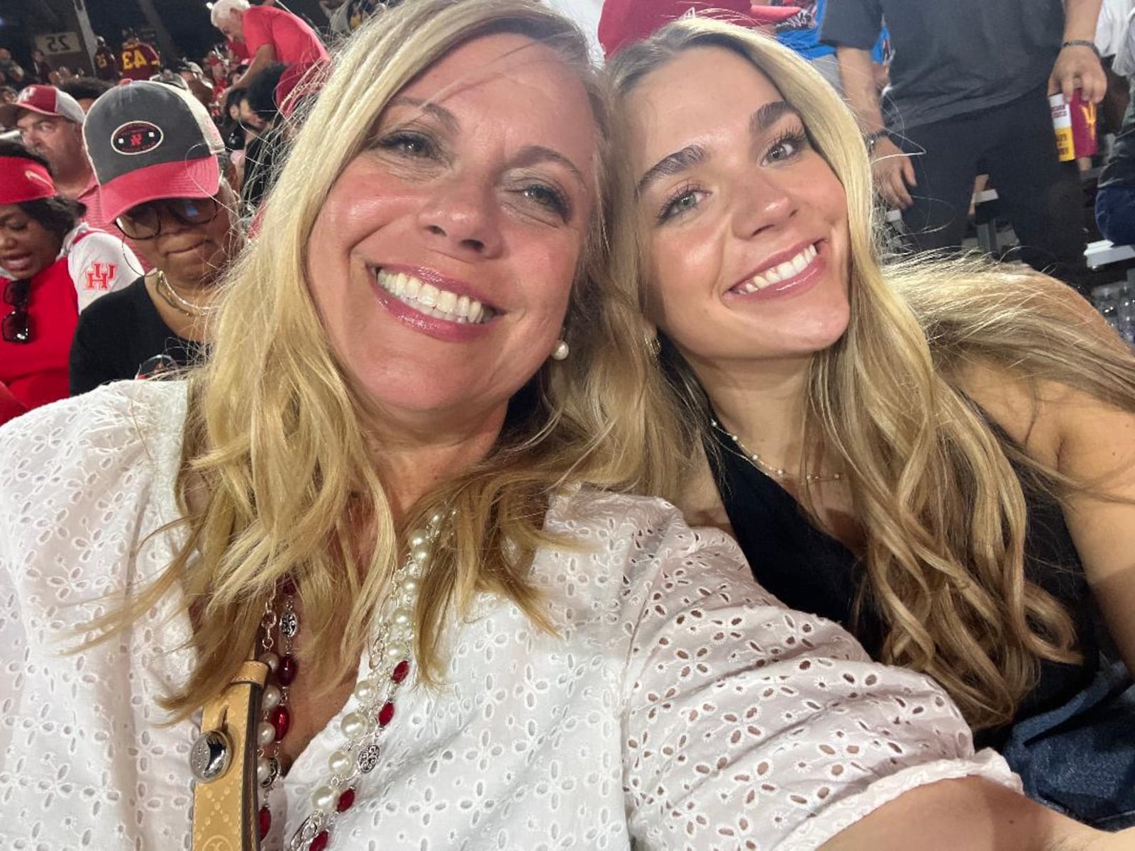 Jennifer Henson (Left) and her daughter Etta at the University of Houston versus Arizona State football game last year. They came to cheer on one of Henson's former tutoring students Dalton Merryman. CONTRIBUTED