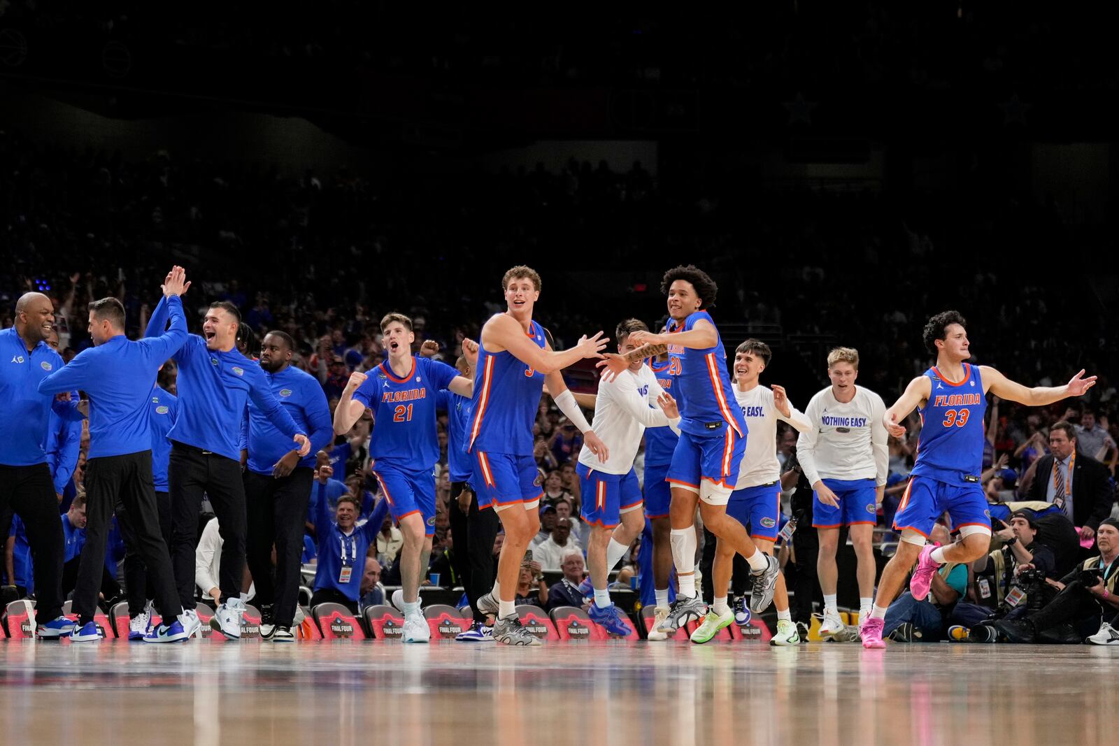 Florida celebrates their win against Auburn in the national semifinals at the Final Four of the NCAA college basketball tournament, Saturday, April 5, 2025, in San Antonio. (AP Photo/Brynn Anderson)