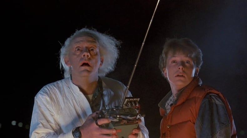 Christopher Lloyd (left) and Michael J. Fox in Robert Zemeckis’ 1985 comedy “Back to the Future.” CONTRIBUTED