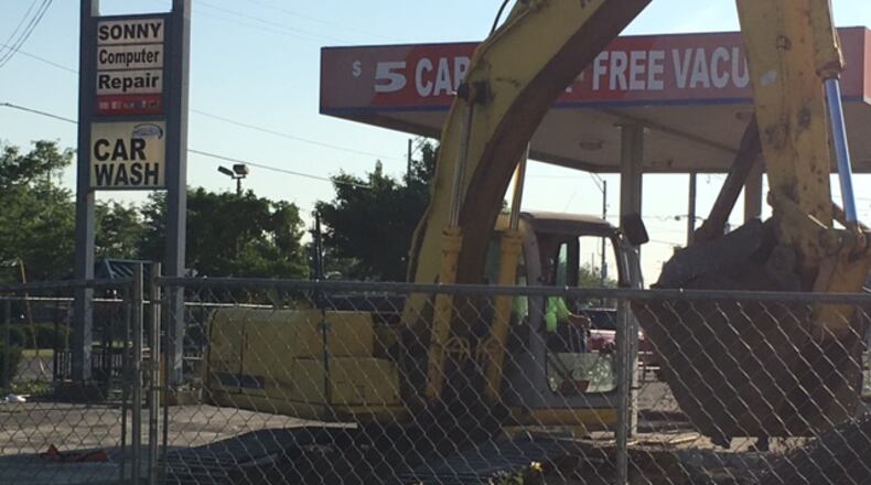 The first phase of a demolition of a former car wash has started as part of a three-way deal that will bring a Kettering Health Network office building to West Carrollton. NICK BLIZZARD/STAFF