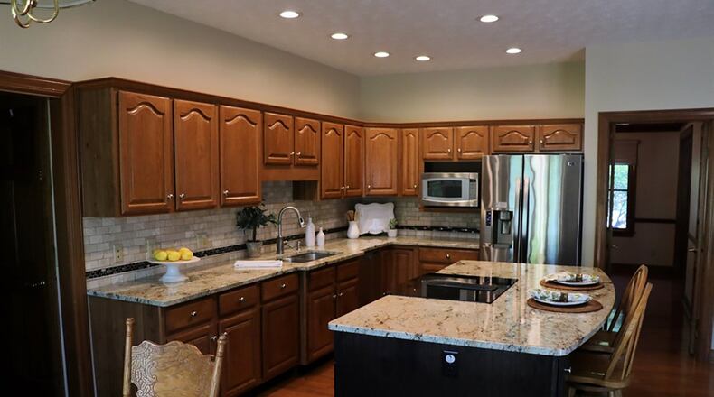 As the hub of the gathering space, the kitchen has an elegant look with updated granite countertops and stainless-steel appliances.