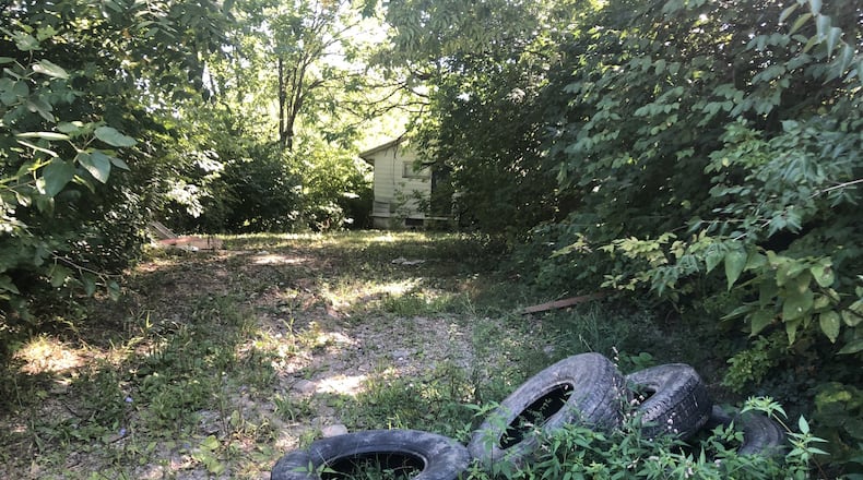 Tires dumped in an alley in West Dayton. CORNELIUS FROLIK / STAFF