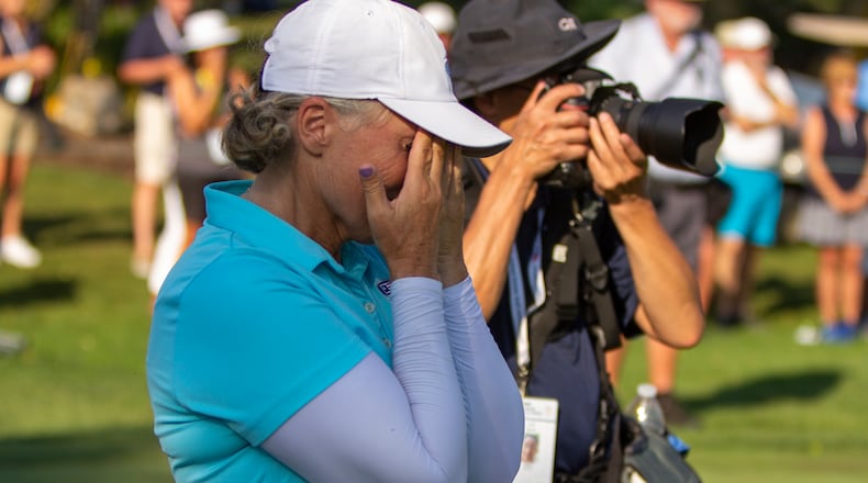 Jill McGill's sister and caddie, Shelley O'Keefe, cries while McGill talks about her during the trophy presentation Sunday at the U.S. Senior Women's Open at NCR Country Club. CONTRIBUTED/Jeff Gilbert