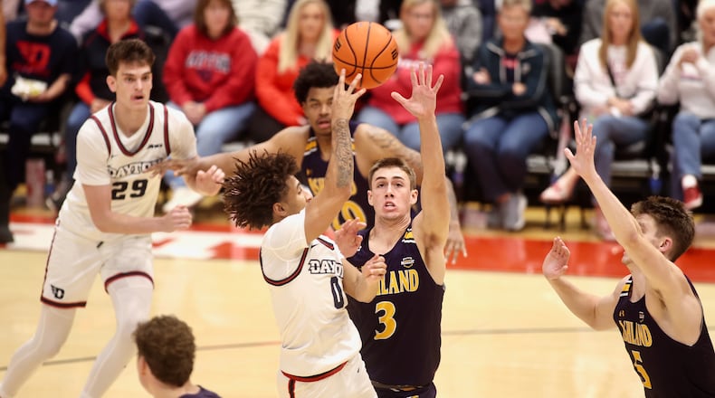 Dayton's Javon Bennett makes a pass against Ashland in an exhibition game on Saturday, Oct. 26, 2024, at UD Arena. David Jablonski/Staff