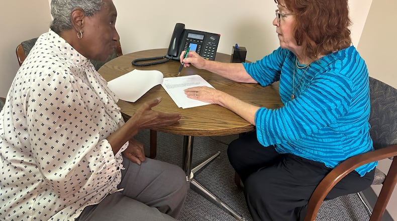 Ombudsman assists a client. CONTRIBUTED