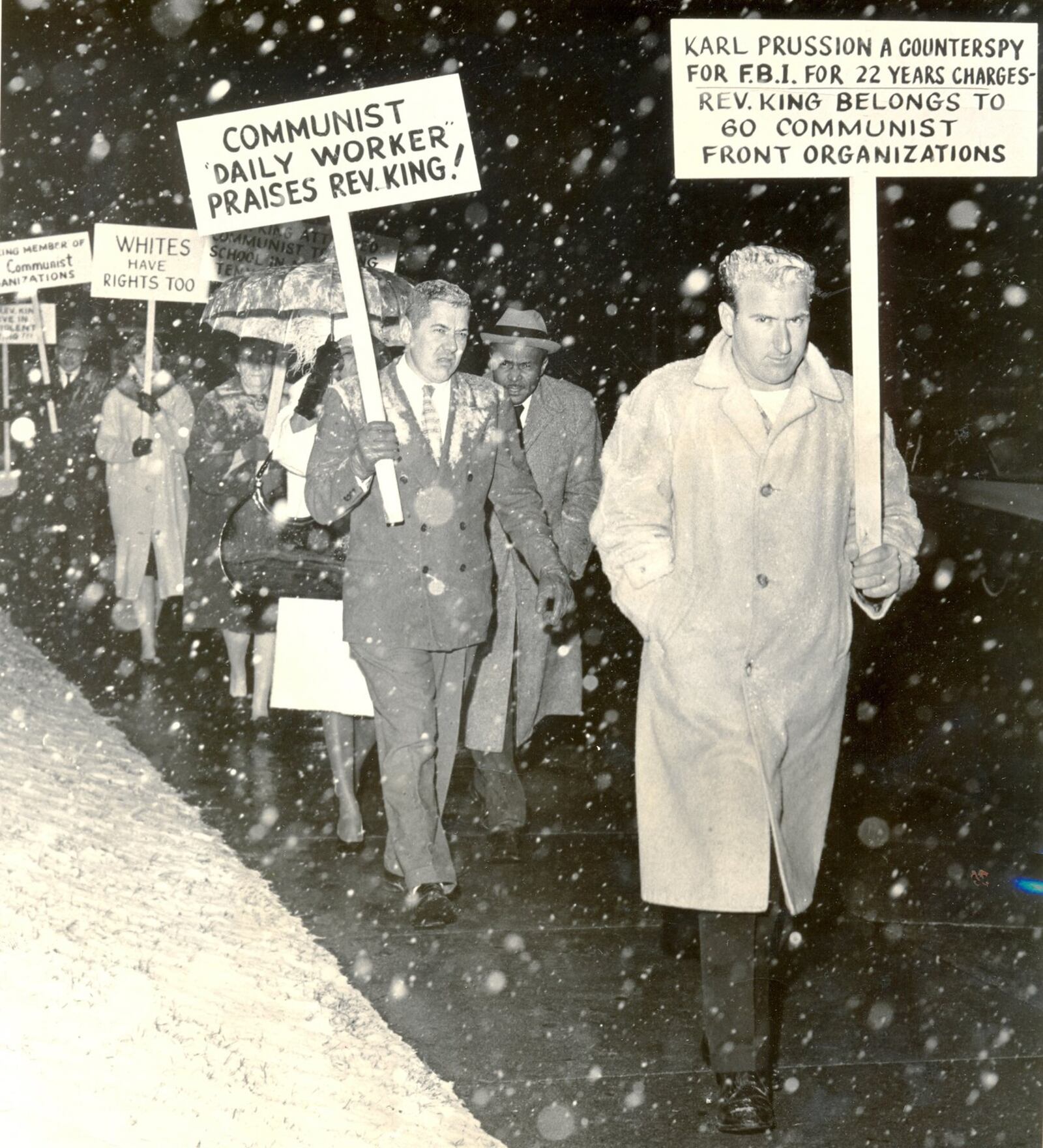 From the Dayton Daily News archives. Pickets at the University of Dayton fieldhouse were undaunted by the cold weather and snow last night as they protested the appearance of Dr. Martin Luther King, Nobel Peace Prize winner. The pickets were carrying signs condemning the civil rights act and charging King with association with the Communist party.