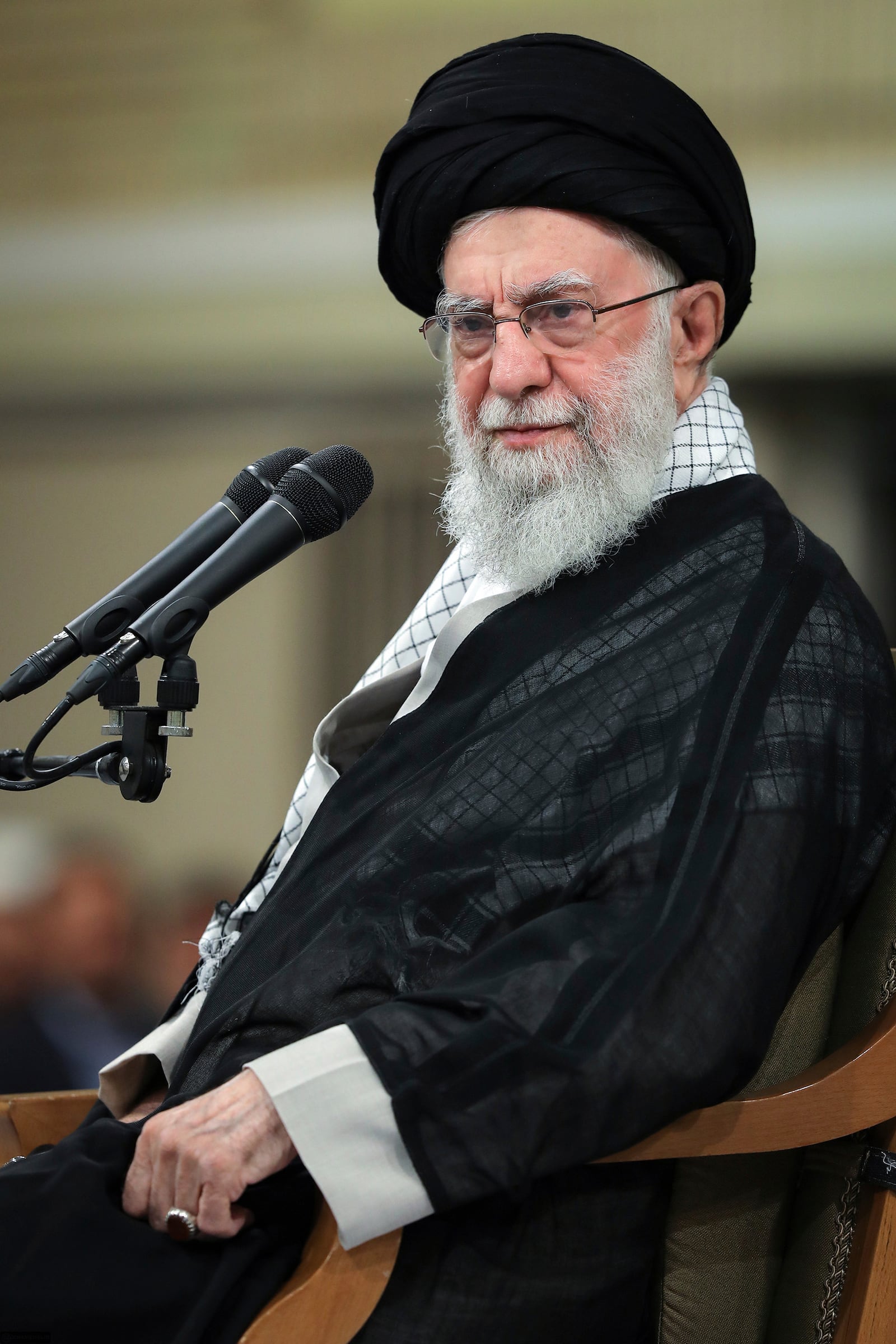 In this photo released by an official website of the office of the Iranian supreme leader, Supreme Leader Ayatollah Ali Khamenei attends a meeting with teachers, in Tehran, Iran, Saturday, May 17, 2025. (Office of the Iranian Supreme Leader via AP)