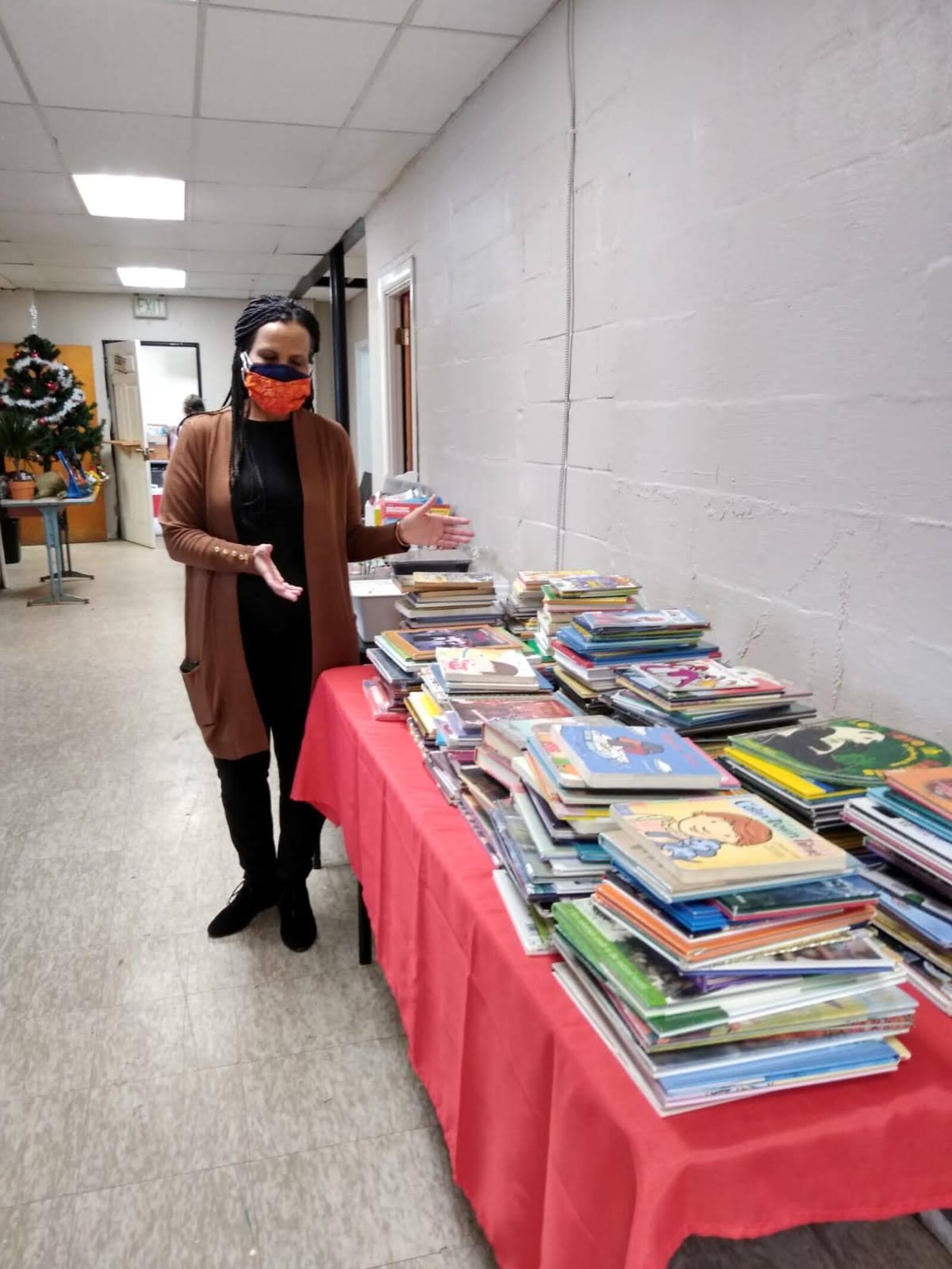 Co Founder, Veleta Jenkins, prepares to distribute books to students through Dayton youth programs.