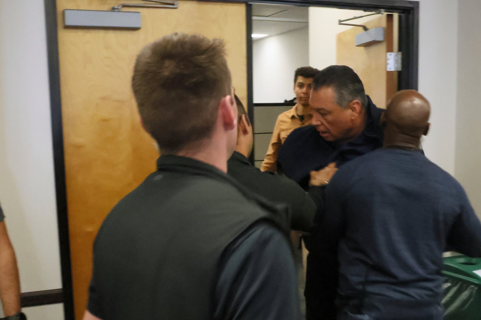 California Senator Alex Padilla is pushed out of the room as Noem holds a news conference regarding the recent protests in Los Angeles on Thursday, June 12, 2025. (AP Photo/Etienne Laurent)
