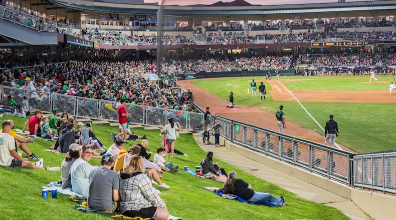 The Dayton Dragons played their home opener on Tuesday, Apr. 11, 2023 at Day Air Ballpark in downtown Dayton to a sellout crowd of 8,135, extending the team’s streak to 1,442 games, an all-time record for professional sports franchises. The Dragons lost to the Great Lakes Loons 9-7. Did we spot you there? TOM GILLIAM/CONTRIBUTING PHOTOGRAPHER