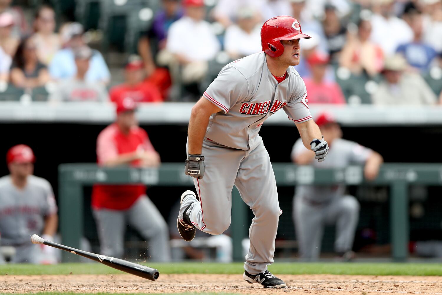 PHOTOS: Reds pile up 13 hits, beat the Rockies