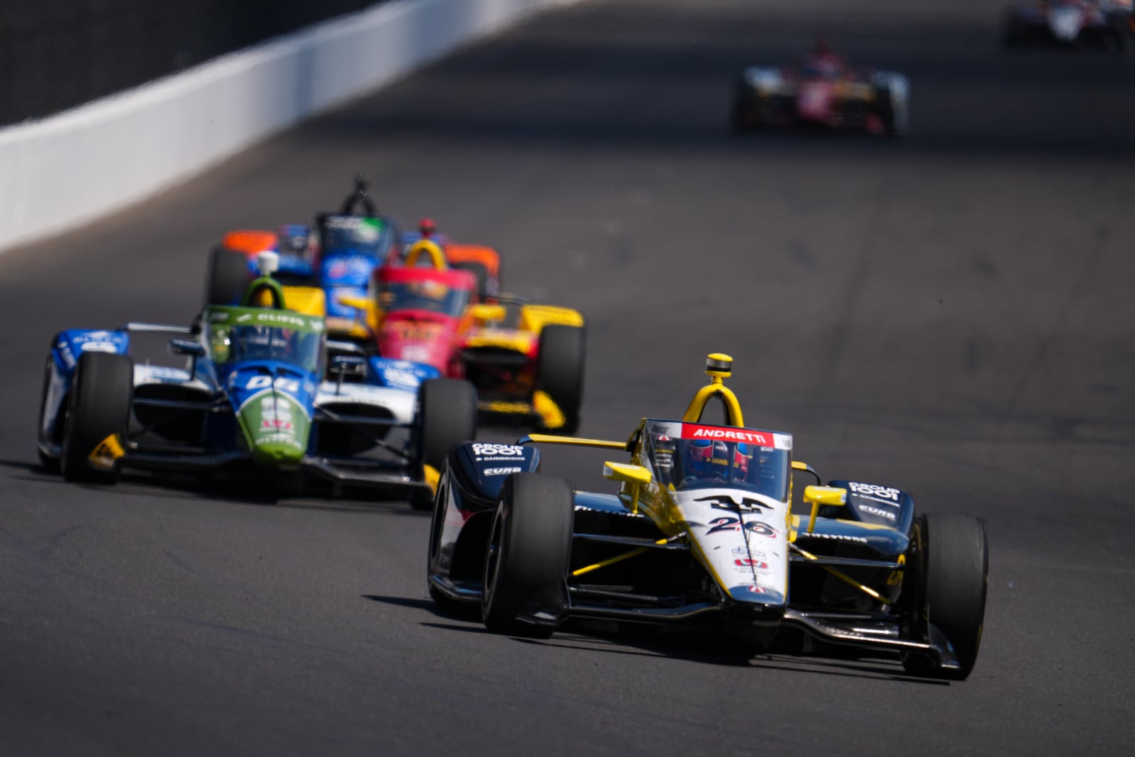 Colton Herta drives into the first turn during practice for the Indianapolis 500 auto race at Indianapolis Motor Speedway in Indianapolis, Friday, May 23, 2025. (AP Photo/Michael Conroy)