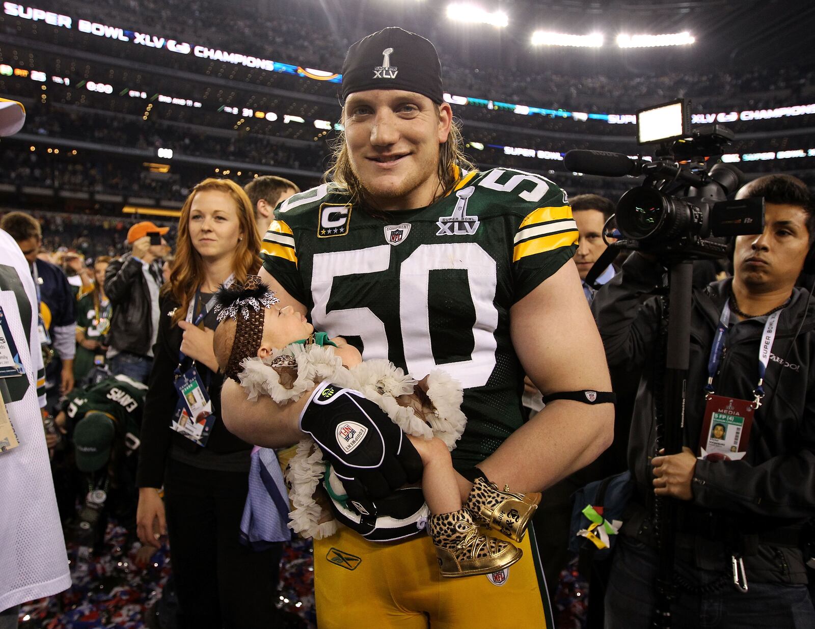 A.J. Hawk celebrated the Packers' Super Bowl win with his baby daughter Lennon after winning Super Bowl XLV 31-25 against the Pittsburgh Steelers at Cowboys Stadium on February 6, 2011 in Arlington, Texas.  (Photo by Al Bello/Getty Images)