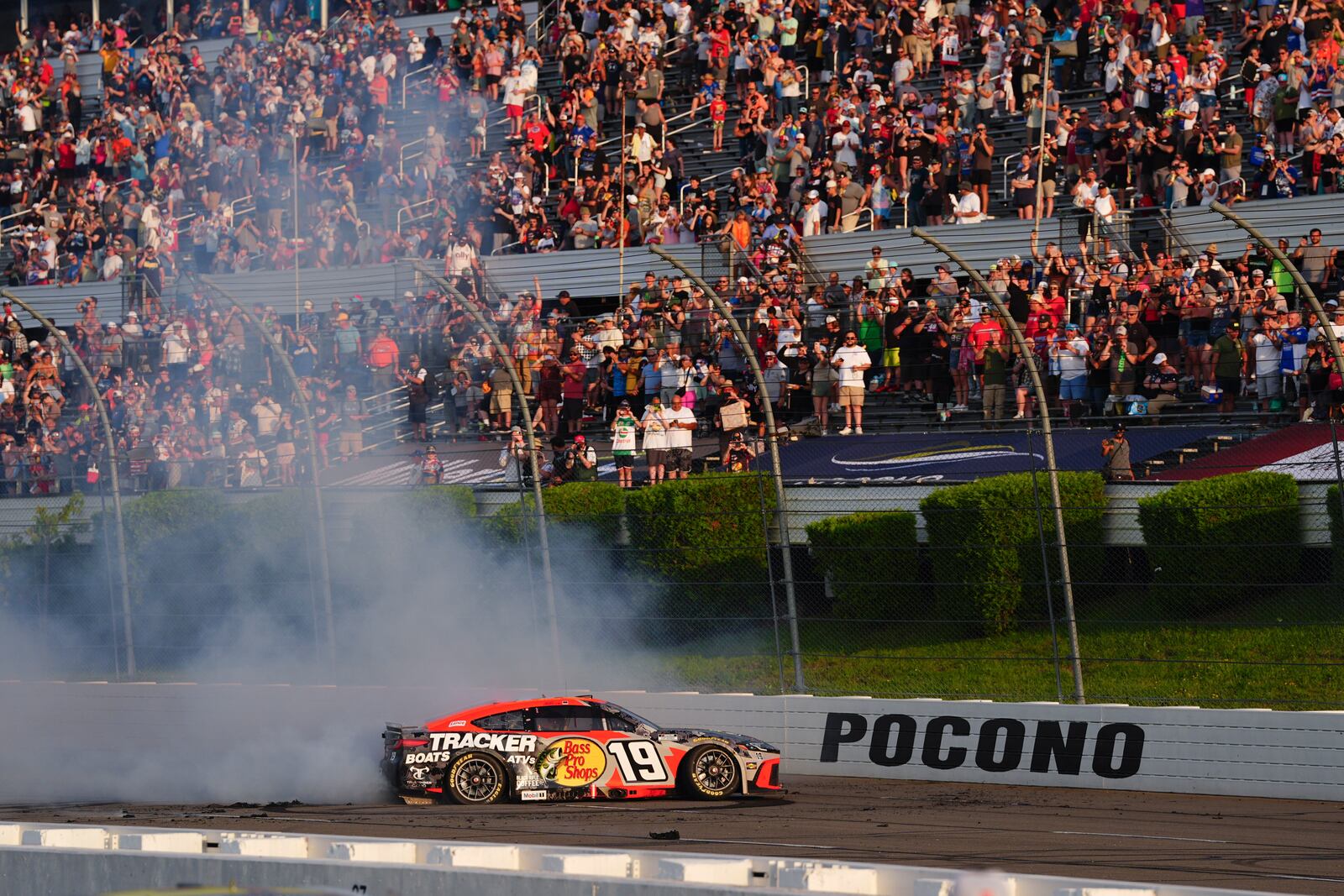 Chase Briscoe celebrates with a burnout after winning a NASCAR Cup Series auto race at Pocono Raceway, Sunday, June 22, 2025, in Long Pond, Pa. (AP Photo/Derik Hamilton)