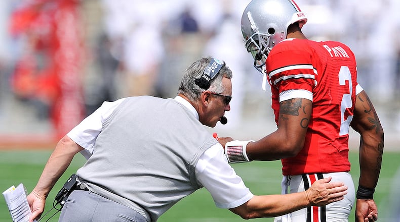 COLUMBUS, OH - SEPTEMBER 05: Head coach Jim Tressel of the Ohio State Buckeyes congratulates his quarterback Terrelle Pryor #2 after the Buckeyes added another touchdown against the Navy Midshipmen at Ohio Stadium on September 5, 2009 in Columbus, Ohio. Ohio State defeated Navy 31-27. (Photo by Jamie Sabau/Getty Images)