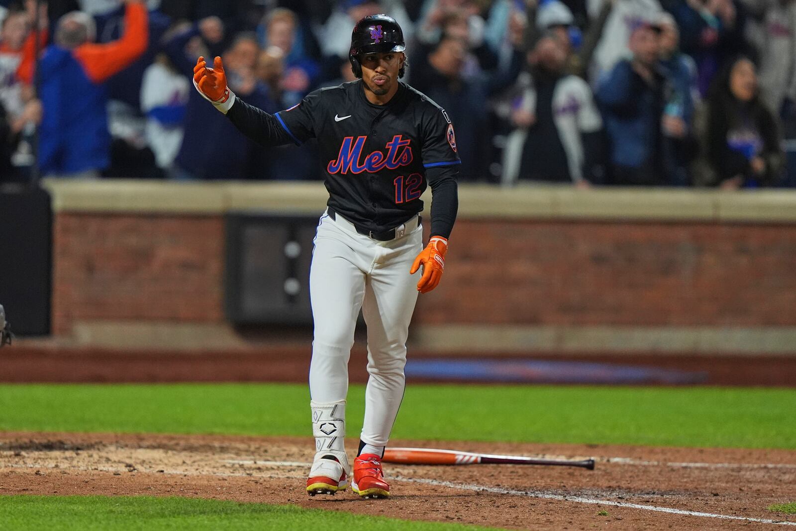 New York Mets' Francisco Lindor (12) celebrates after hitting a walk-off home run during the ninth inning of a baseball game against the St. Louis Cardinals Friday, April 18, 2025, in New York. (AP Photo/Frank Franklin II)