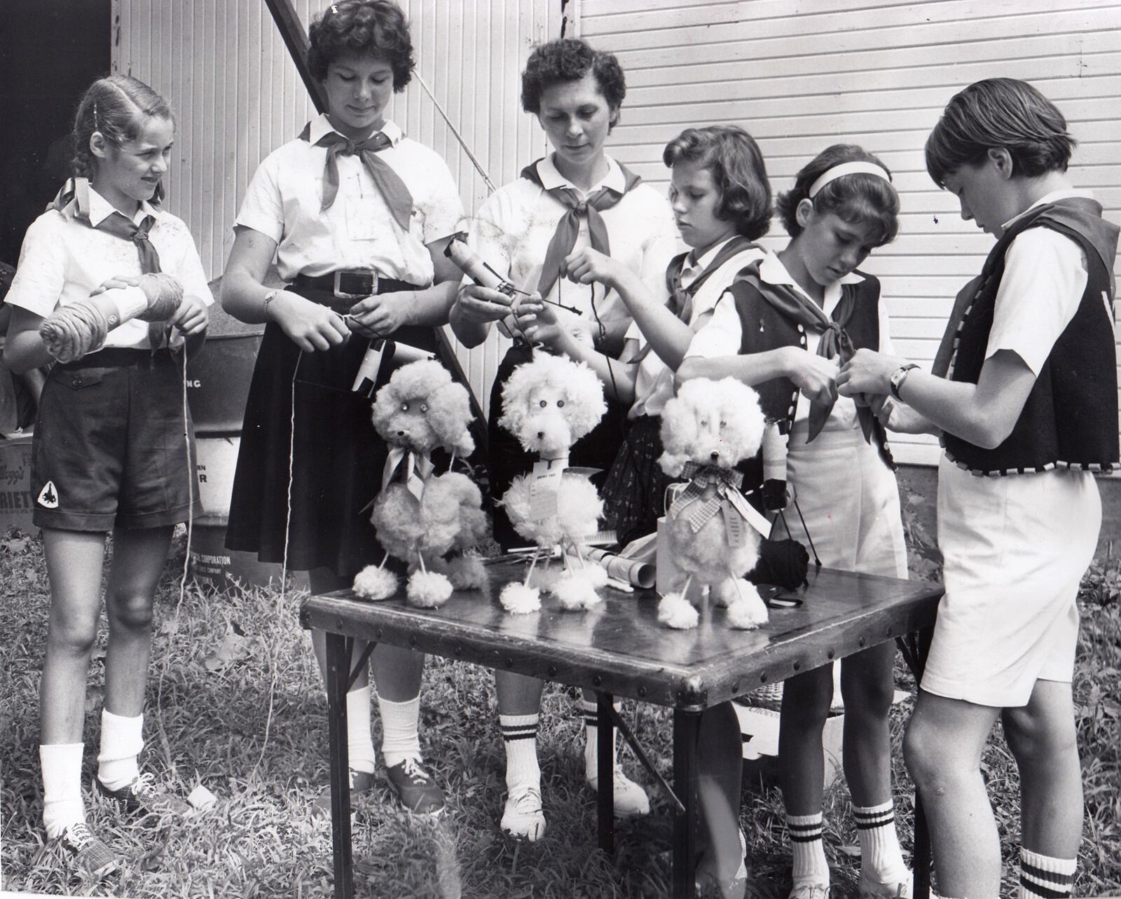 The Xenia Campfire Girls make yarn poodles to enter in a competition at the 1961 Greene County Fair. DAYTON DAILY NEWS ARCHIVE