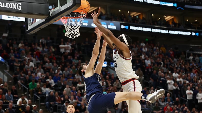 Dayton's DaRon Holmes II scores in the final minutes of the second half against Nevada in the first round of the NCAA tournament on Thursday, March 21, 2024, at the Delta Center in Salt Lake City, Utah. David Jablonski/Staff