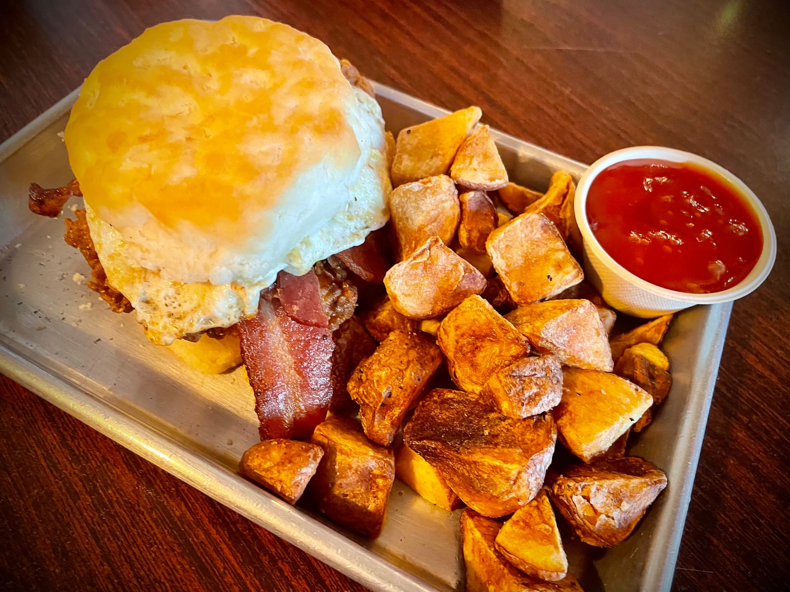 Fifth Street Brewpub is located at 1600 E. Fifth St. in Dayton's St. Anne's Hill neighborhood. Pictured is the Chicken Pimento sandwich. NATALIE JONES/STAFF