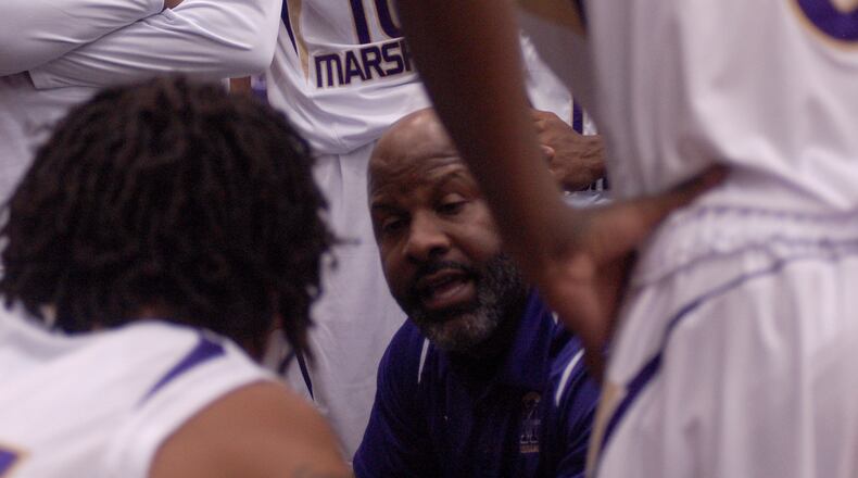 Thurgood Marshall coach Shawn McCullough talks to the Cougars during a timeout in the first half Friday night at Thurgood Marshall. JOHN CUMMINGS / CONTRIBUTED
