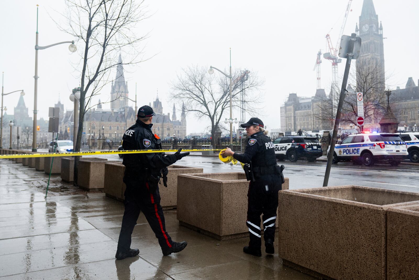 Members of the Ottawa Police Service secure the scene after a man barricaded himself in Parliament Hill in Ottawa, Ontario, Saturday, April 5, 2025. (Spencer Colby/The Canadian Press via AP)