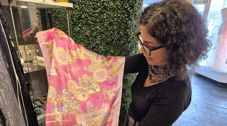 Bahar Omrani, owner of Bahar & Reza, is relocating her Oakwood couture clothing store to Centerville to provide a larger, brighter shop for her clients and employees. MICHAEL KURTZ / STAFF