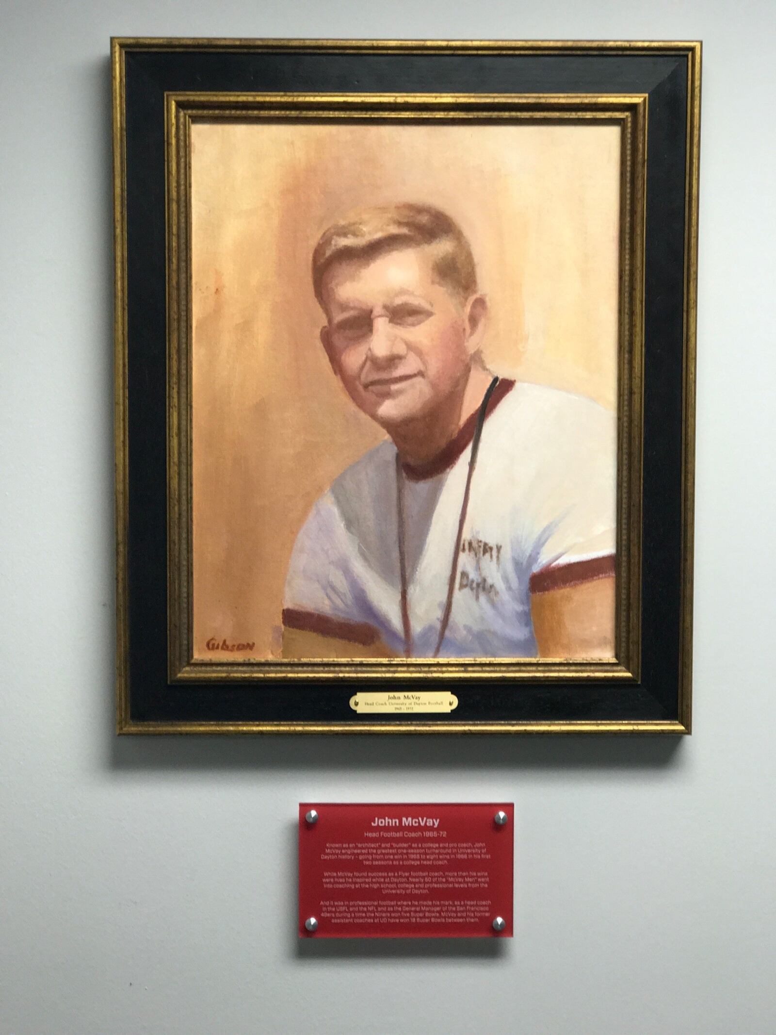 Portrait of former University of Dayton football coach John McVay that was done by Kettering artist Greg Gibson and just hung in UD football offices last week. Tom Archdeacon/CONTRIBUTED