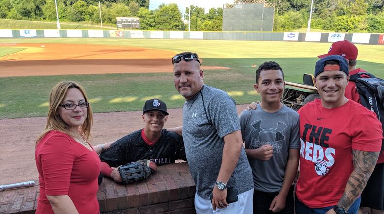 Brian Rey when he played with the Greeneville Reds , the Cincinnati Reds’ rookie league team In Greeneville, Tennessee, flanked by his family. (left to right) Maritza Feliciano (Rey), Brian’s mom; Brian, Orlando Rey, Brian’s dad; younger brother Brandon; older brother Jonathan. CONTRIBUTED
