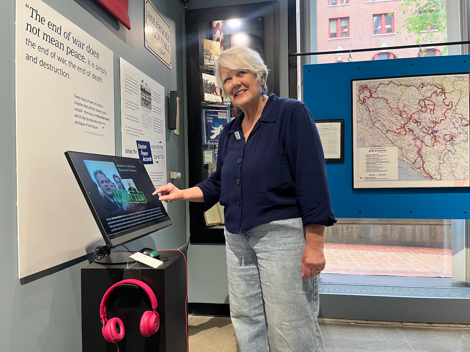 Mary Ramey stands next to the interactive exhibit she helped create at the Peace Museum.
Photo: MEREDITH MOSS/CONTRIBUTED