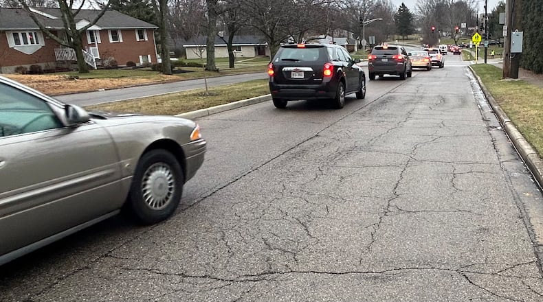 Among the city of Kettering's capital projects planned for 2024 is repaving and other work on East David Road (seen here), from Far Hills to Ackerman. JEREMY P. KELLEY / STAFF