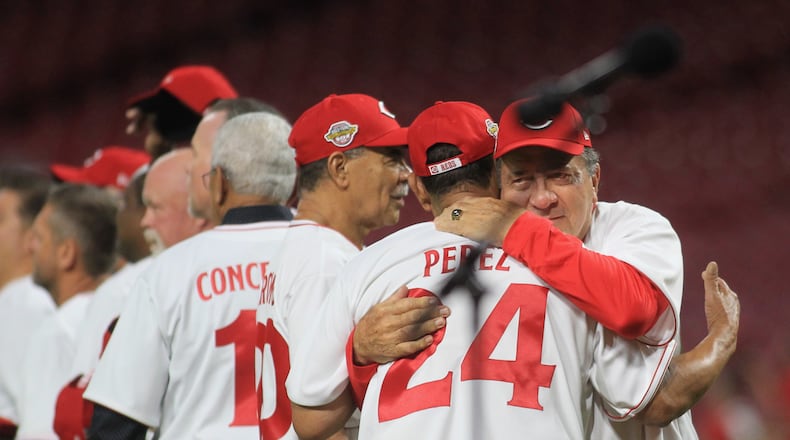 Johnny Bench hugs Tony Perez before the Cincinnati Reds Legends Game at Great American Ball Park on Friday, Aug. 27, 2021, at Great American Ball Park. David Jablonski/Staff