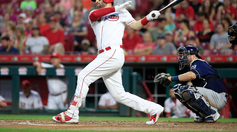 CINCINNATI, OH - AUGUST 29: Curt Casali #38 of the Cincinnati Reds hits a RBI double in the second inning against the Milwaukee Brewers at Great American Ball Park on August 29, 2018 in Cincinnati, Ohio. (Photo by Andy Lyons/Getty Images)