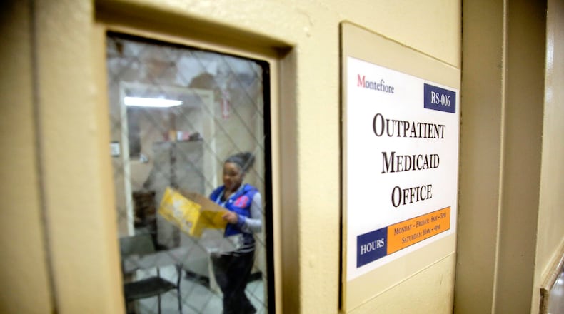 FILE - A Medicaid office employee works on reports at Montefiore Medical Center, Nov. 21, 2014, in New York.  (AP Photo/Julie Jacobson, File)