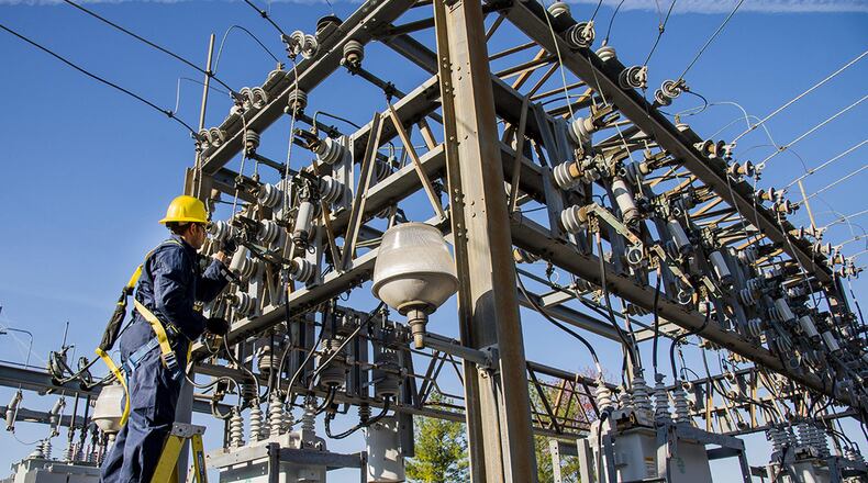 Staff Sgt. Manoj Williams, 375th Civil Engineer Squadron electrical systems craftsman, greases framework knife blades and tightens loose conductor connections April 9, 2016, at Scott Air Force Base, Ill. The base required a scheduled power outage to repair critical high-voltage electrical components. (U.S. Air Force photo/Airman Daniel Garcia)