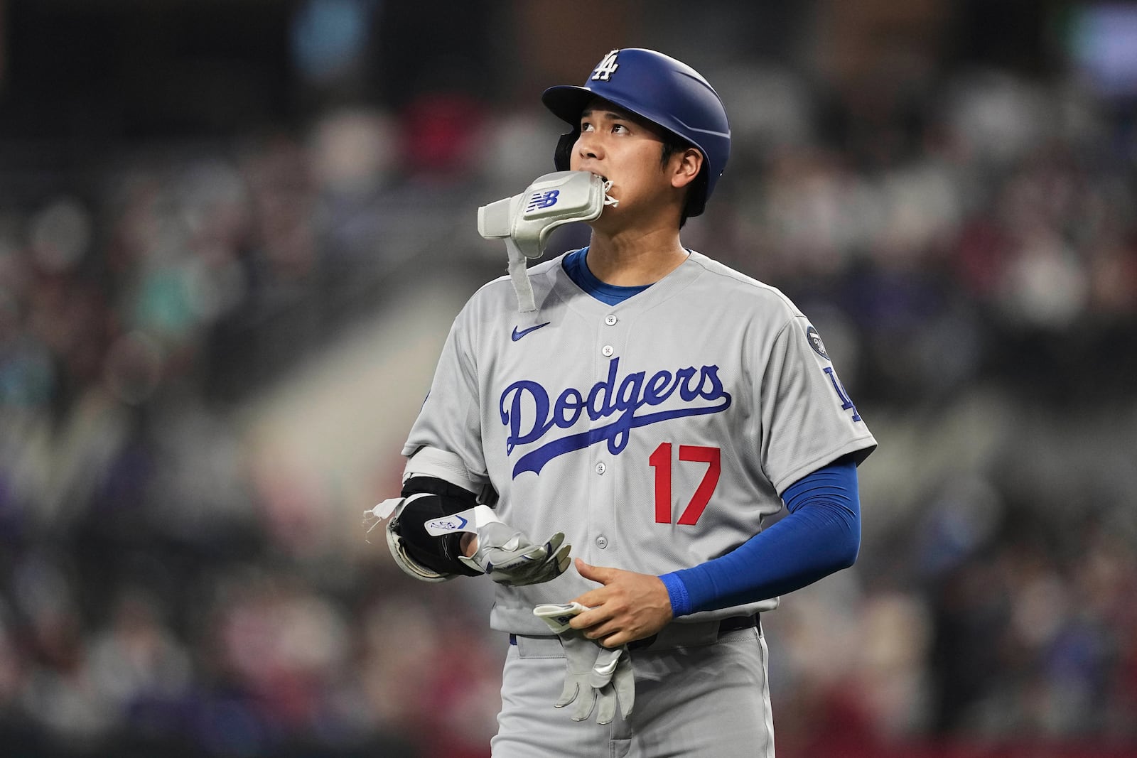 Los Angeles Dodgers' Shohei Ohtani walks to the dugout after grounding out to first in the fifth inning of a baseball game against the Texas Rangers in Arlington, Texas, Sunday, April 20, 2025. (AP Photo/Tony Gutierrez)