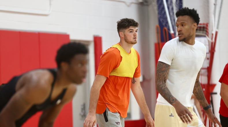 Former Wright State forward Grant Basile, center, practices with the Red Scare for The Basketball Tournament on Tuesday, July 16, 2024, at the Cronin Center in Dayton. David Jablonski/Staff
