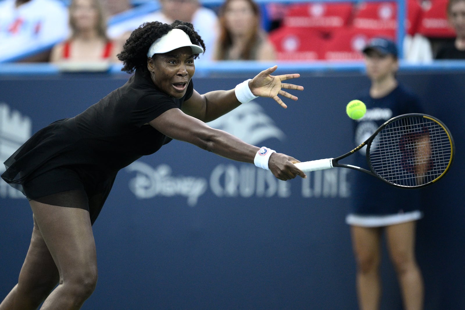 Venus Williams lunges for the ball during a match against Magdalena Frech, of Poland, at the Citi Open tennis tournament Thursday, July 24, 2025, in Washington. (AP Photo/Nick Wass)