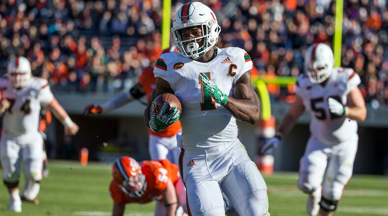CHARLOTTESVILLE, VA - NOVEMBER 12: Mark Walton #1 of the Miami Hurricanes runs the ball during Miami’s game against the Virginia Cavaliers at Scott Stadium on November 12, 2016 in Charlottesville, Virginia. (Photo by Chet Strange/Getty Images)