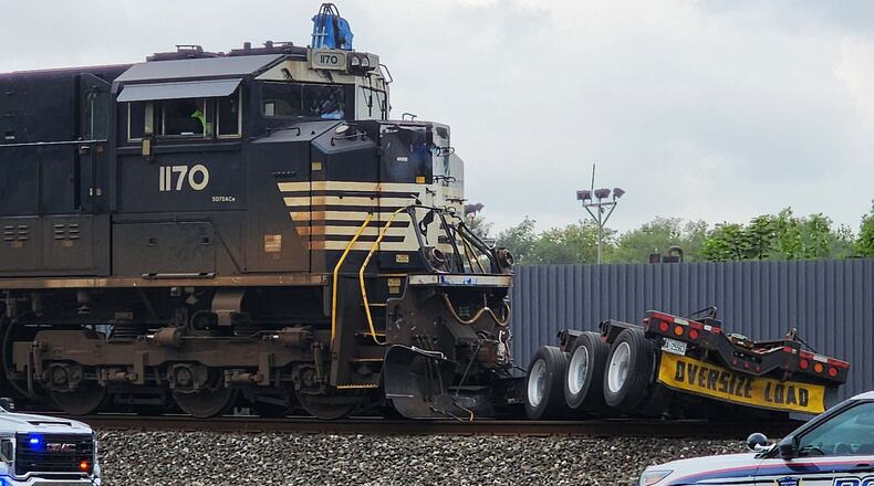 A semi stuck on the tracks at Woodlawn Avenue and University Boulevard was struck by a train Sept. 7, 2023. NICK GRAHAM/STAFF