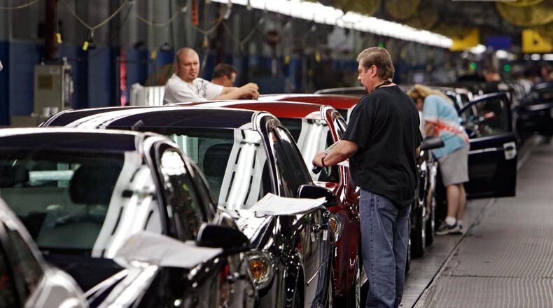 Workers at General Motors’ Lordstown Assembly plant in Lordstown, Ohio put the final touches on 2011 Chevrolet Cobalts in this file photo. AP Photo/Mark Duncan