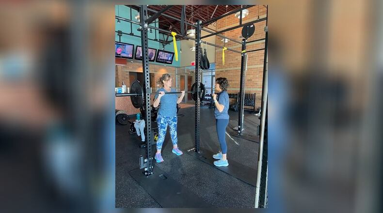 Mary Raiff of Butler Twp., right, has been devoted to health and wellness most of her life. Here she is seen helping a client. CONTRIBUTED