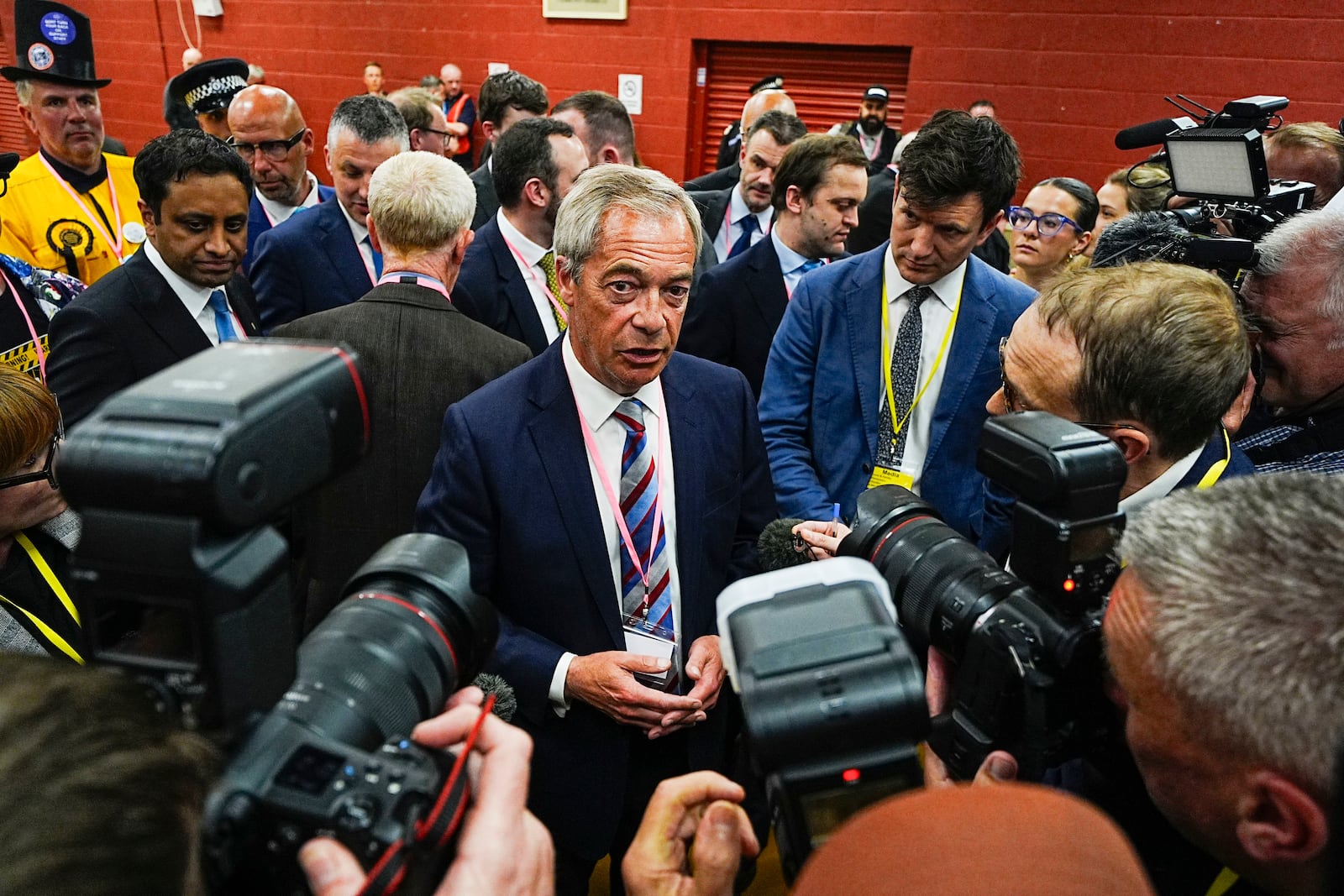 Reform UK party leader Nigel Farage talks to the media after Sarah Pochin won the Runcorn and Helsby by-election at DCBL Halton Stadium, Widnes, Cheshire, Friday, May 2, 2025. (Peter Byrne/PA via AP)