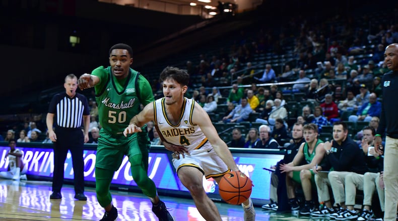 Wright State's Keaton Norris drives past Marshall's Jalen Speer during a game earlier this season at the Nutter Center. Joe Craven/Wright State Athletics